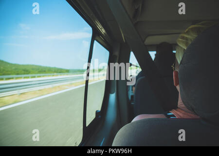 Tourists go to travel by minibus. Stock Photo