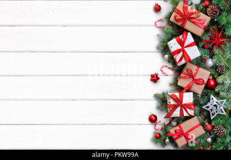 Gift Boxes And Fir Branches On White Table - Christmas Card Stock Photo