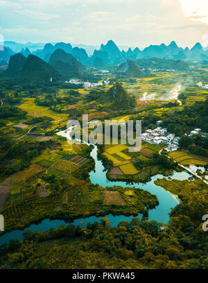 Drone photo of sunset in Yangshuo rice fields in China Stock Photo