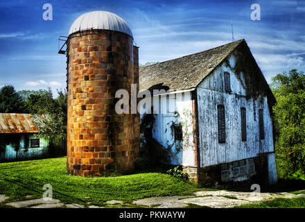 Old weathered barn image and other images of rustic items around it in countryside. Stock Photo