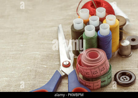 composition of seamstress, tailor, thread for sewing and for knitting Stock Photo