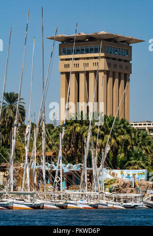 Movenpick Hotel resort concrete tower with traditional felucca saling boats, River Nie, Aswan, Egypt, Africa Stock Photo