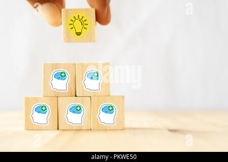 hand man try to pull or put an idea after the positive thinking team are brainstorm, meeting, discuss, find a solution, resolve the problem Stock Photo