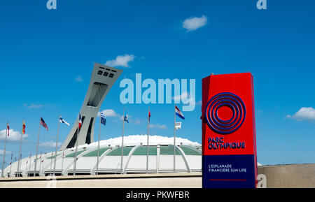 Olympic Park sign at the Montreal Tower and the Montreal Olympic Stadium in QC, Canada Stock Photo