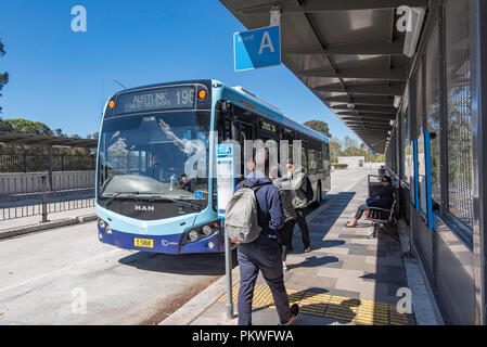 People boarding a public transport bus at the new train and bus interchange at Gordon, New South Wales in Australia Stock Photo