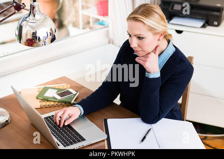 Businesswoman using laptop Stock Photo