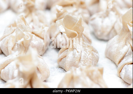 Homemade fresh wonton dumplings. Close up photo. Stock Photo