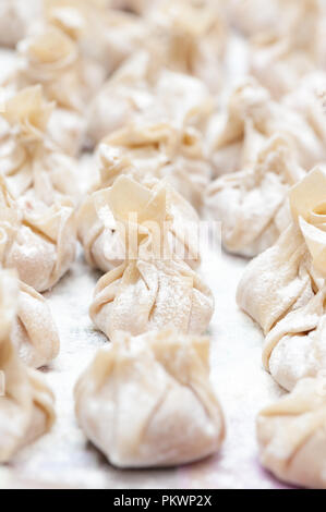 Homemade fresh wonton dumplings. Close up photo. Stock Photo