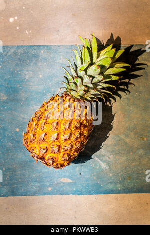 Ripe aromatic pineapple on a concrete background Stock Photo - Alamy