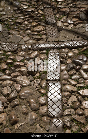 Old paving in a historical city. Paving made of natural stones and devided by bricks with structure. Glossy from all the steps done on them. Vrbnik, i Stock Photo