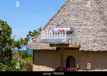 GALU - KINONDO BEACH, KENYA - FEBRUARY 26, 2018: Systems for heating water from sunlight ( sun collectors) on roofs of hotel Neptune Paradise Beach Re Stock Photo