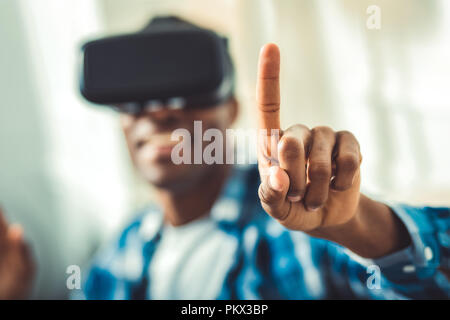Happy young afro american man switching mode Stock Photo