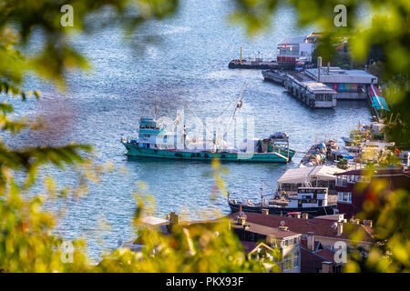 Zoomed view of fishing boat in Sariyer bay. Sariyer is a district of Istanbul, at the end of the Bosphorus strait to the north in the European side. Stock Photo