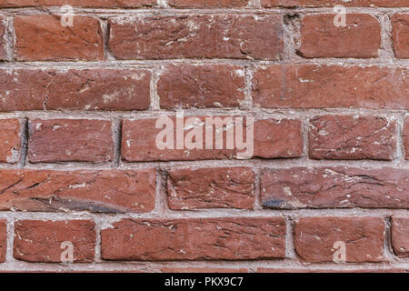 Background building materials: Texture of a wall of aged red brick closeup Stock Photo