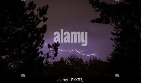 Lightning Flashes Across a Stormy Night Sky with houses Stock Photo - Alamy