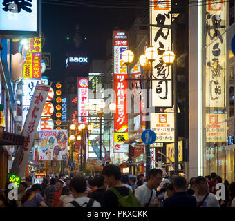 Crowds of people on the main street of the Dotonbori nightlife district in Osaka, Japan. Stock Photo