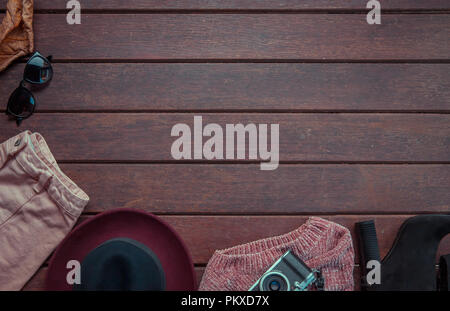 Autumn composition and accessories. Autumn leaves, retro camera, warm clothes. Flat lay, top view. Fashion concept Stock Photo