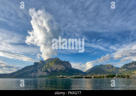 Panorama of Lecco with the mountains in the background and a huge cloud on Mount San Martino,Italy Stock Photo
