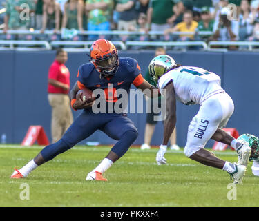 Chicago, USA. 15th September 2018.  Illinois Fighting Illini quarterback M.J. Rivers II (8) eludes a tackle attempt during NCAA football game action between the University of Illinois Fighting Illini vs the University of South Florida Bulls at Soldier Field in Chicago, IL Credit: Cal Sport Media/Alamy Live News Stock Photo