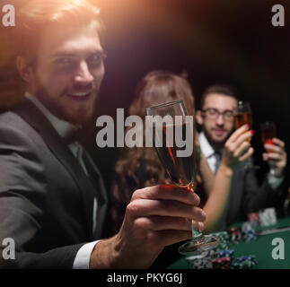 poker player with a glass of wine Stock Photo