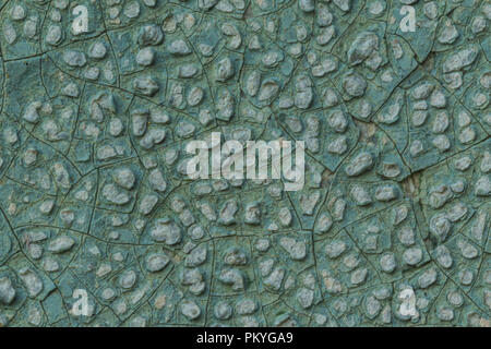 Macro photo. Texture of an old blue paint. Several layers. The concrete wall of the house was washed by rain. A good background for different sites. Stock Photo