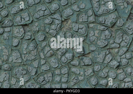 Macro photo. Texture of an old blue paint. Several layers. The concrete wall of the house was washed by rain. A good background for different sites. Stock Photo