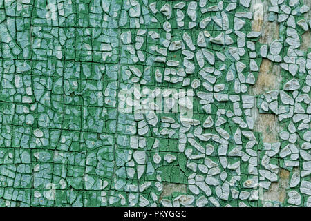 Macro photo. Texture of an old blue paint. Several layers. The wooden wall of the house was washed by rain. A good background for different sites. Stock Photo