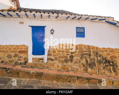 Barichara, Colombia, Santander, colonial street with white historic buildings door and widow Stock Photo
