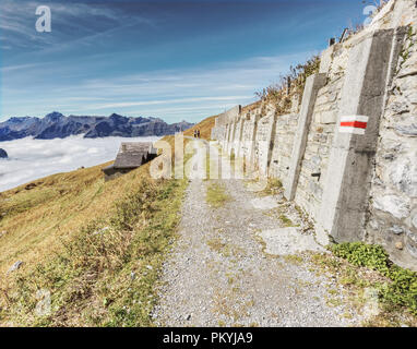 Tracking path of Eiger walk on top of the clouds from Jungfrau, Switzerland Stock Photo