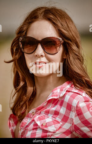 Portrait of a beautiful girl with sunglasses. Stock Photo