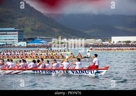 Fautasi longboats racing at full speed during the Fautasi Ocean Challenge 2012 (part of Teuila Festival). Stock Photo