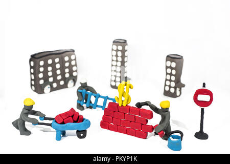 Abstract photo of buildings works. Figures made from Play Clay. Isolated on white background. Stock Photo