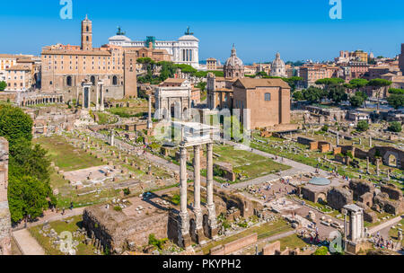 Scenic sight in the Roman Forum, with the Campidoglio Hill, the Vittoriano monument and the Settimio Severo Arch. Stock Photo