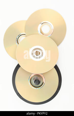 Group of DVD discs, top view. Stack of blank compact disks over white background, vertical image. Shiny data storage. Stock Photo