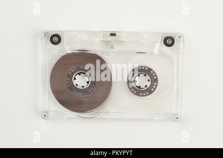 Transparent cassette with clipping path. Audio cassette tape isolated on white background, horizontal image. Retro music technology. Stock Photo