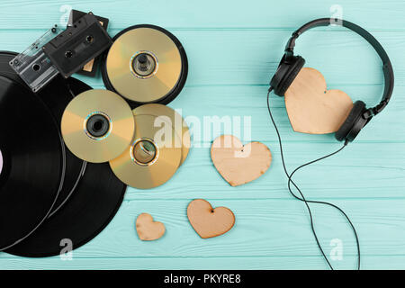 Vintage musical devices and wooden hearts. Stock Photo