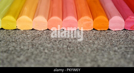 Pencil from wax lined up, colorful background with multicolor sticks in pastel color on the granite table with copy space Stock Photo