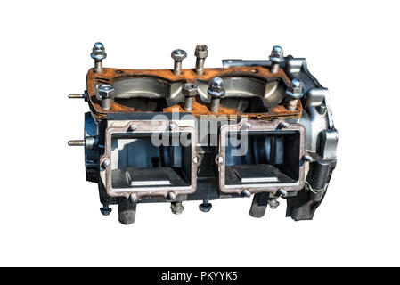 A disassembled block of a two-cylinder engine isolated on a white background with a clipping path. Stock Photo