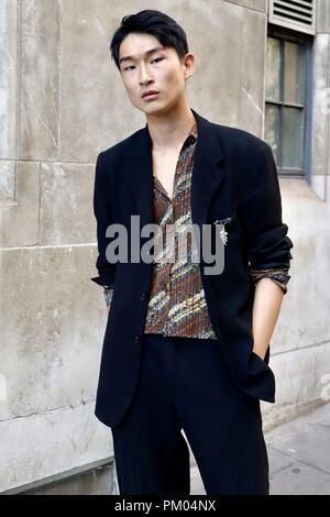 Artist and model Sang Woo Kim outside the BFC Show Space during London Fashion Week. Stock Photo