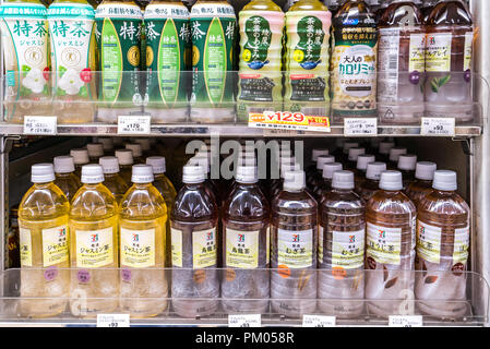 TOKYO, JAPAN - June 23 2018 : Drink products in Japanese supermarket taken in Tokyo. Variety of drinks on shelves in convenience store in Japan.