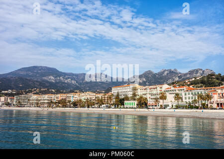 Menton resort town skyline from the sea in France, French Riviera coastline, Alpes-Maritimes, Provence-Alpes-Cote d'Azur region. Stock Photo