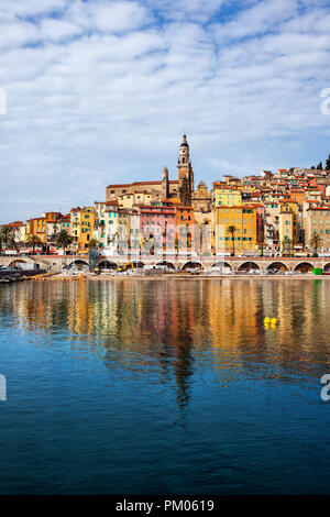 Menton in France, old town reflection in Mediterranean Sea, townscape on French Riviera Stock Photo