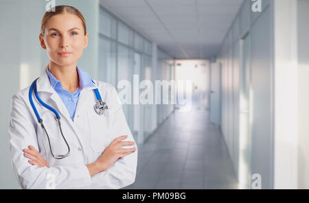 Young woman doctor on the background of the clinic Stock Photo