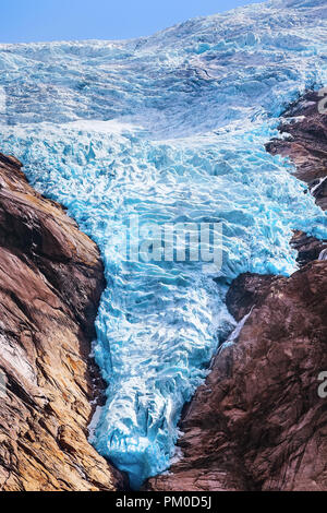 Briksdal or Briksdalsbreen glacier with melting blue ice, Norway nature landmark close-up view Stock Photo