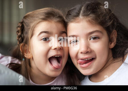 Two girls making silly faces Stock Photo