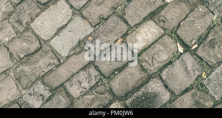 The old road of broken paving stones. It can be used for backgrounds, textures in the graphic editors Stock Photo