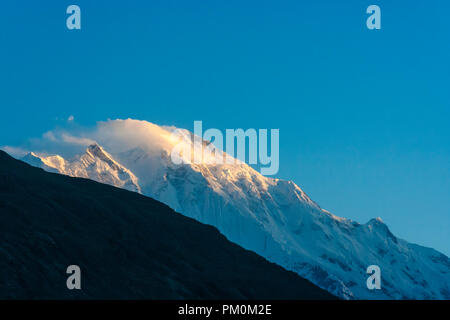 Karimabad, Hunza Valley, Gilgit-Baltistan, Pakistan : Rakaposhi at dawn. A mountain in the Karakoram range, at 7,788 m (25,551 ft) It is the 27th high Stock Photo