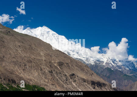 Karimabad, Hunza Valley, Gilgit-Baltistan, Pakistan : Rakaposhi mountain in the Karakoram range, at 7,788 m (25,551 ft) It is the 27th highest in the  Stock Photo