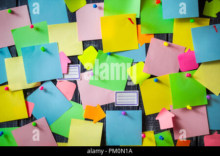 Stickers paper notes post it colored on the board. The concept of brainstorming. Stock Photo