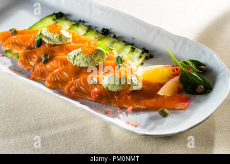 red fish with fresh cucumber and decorated with lemon Stock Photo